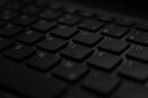 Laptop on a desk showing an email draft