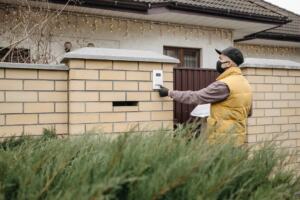 Video doorbell mounted beside a front door